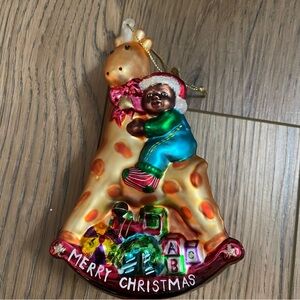 Vintage Glass Toddler on Giraffe Rocking Horse Merry Christmas Ornament 5 1/2”